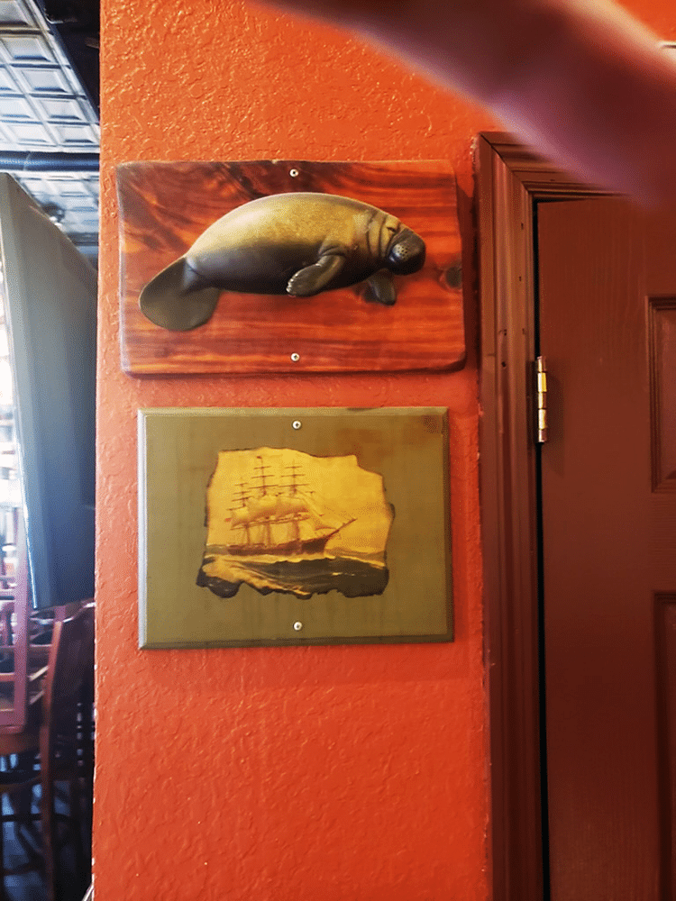 Artifacts & Artwork on the Wall at Gaspar's Grotto in Tampa, FL