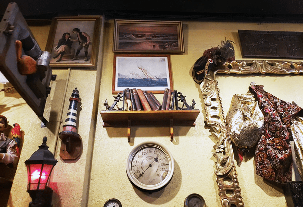 Artifacts & Artwork on the Wall at Gaspar's Grotto in Tampa, FL