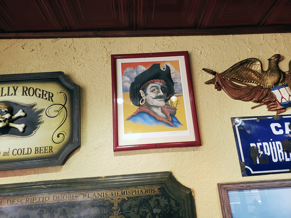 Artifacts & Artwork on the Wall at Gaspar's Grotto in Tampa, FL